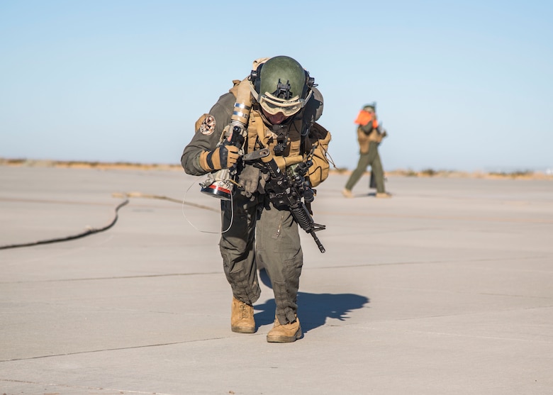 A U.S. Marine with Marine Wing Support Squadron (MWSS) 371, Marine Wing Support Group (MWSG) 37, 3rd Marine Aircraft Wing (MAW), prepares to refuel F-35B Lighting II’s using a tactical aviation ground refueling system (TAGRS) during a forward area refueling point (FARP) operation at Marine Corps Air Station Yuma, Feb. 4, 2020. The TAGRS enables the MWSS to rapidly establish a high-throughput, dual-point refueling site while maintaining critical mobility in austere locations making it a valuable asset for the MAW. (U.S. Marine Corps Photo by Lance Cpl. Julian Elliott-Drouin)