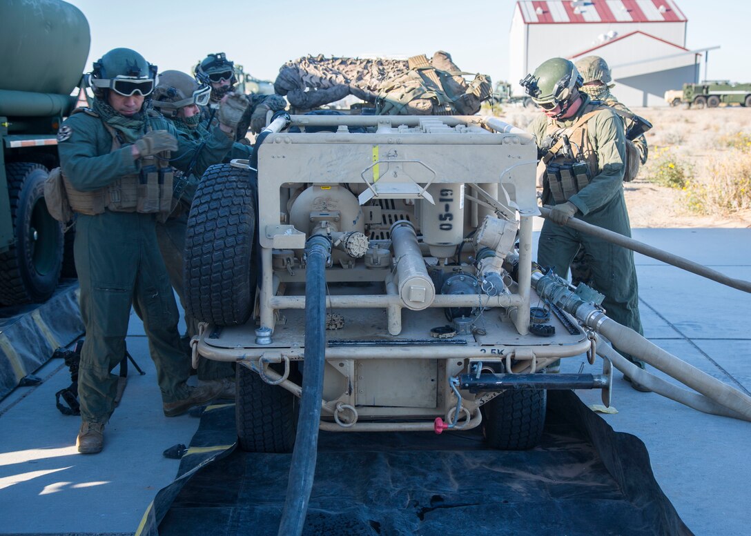 U.S. Marines with Marine Wing Support Squadron (MWSS) 371, Marine Wing Support Group (MWSG) 37, 3rd Marine Aircraft Wing (MAW), operate a tactical aviation ground refueling system (TAGRS) during a forward area refueling point (FARP) operation at Marine Corps Air Station Yuma, Feb. 4, 2020. The TAGRS enables the MWSS to rapidly establish a high-throughput, dual-point refueling site while maintaining critical mobility in austere locations making it a valuable asset for the MAW. (U.S. Marine Corps Photo by Lance Cpl. Julian Elliott-Drouin)