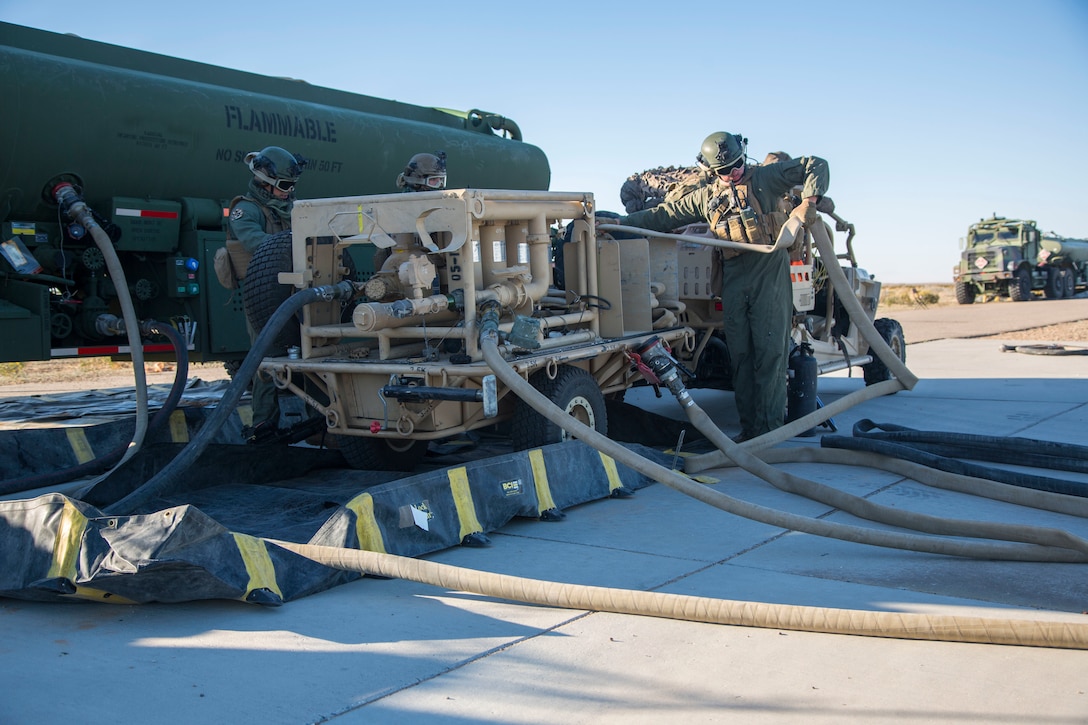 U.S. Marines with Marine Wing Support Squadron (MWSS) 371, Marine Wing Support Group (MWSG) 37, 3rd Marine Aircraft Wing (MAW), operate a tactical aviation ground refueling system (TAGRS) during a forward area refueling point (FARP) operation at Marine Corps Air Station Yuma, Feb. 4, 2020. The TAGRS enables the MWSS to rapidly establish a high-throughput, dual-point refueling site while maintaining critical mobility in austere locations making it a valuable asset for the MAW. (U.S. Marine Corps Photo by Lance Cpl. Julian Elliott-Drouin)