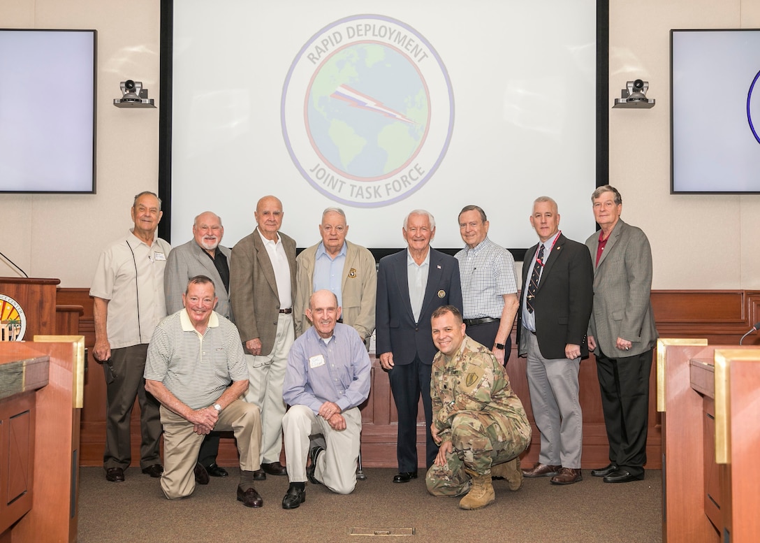 Former senior leadership of the Rapid Deployment Joint Task Force (RDJTF) and historians of U.S. Central Command pose for a group photo during the 40th anniversary of the RDJTF on MacDill Air Force Base, March 3, 2020. (U.S. Marine Corps photo by Sgt. Roderick Jacquote)