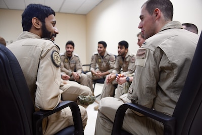 U.S. Air Force and Royal Saudi Air Force E-3 Sentry aircrew members discuss a variety of mission topics during a meet and greet on Prince Sultan Air Base, Kingdom of Saudi Arabia, March 3, 2020. The E-3 and its aircrew are forward deployed to PSAB from Al Dhafra Air Base, United Arab Emirates, as part of an agile combat employment mission meant to test their ability to conduct missions in the region from an austere location. (U.S. Air Force photo by Tech Sgt. Michael Charles)