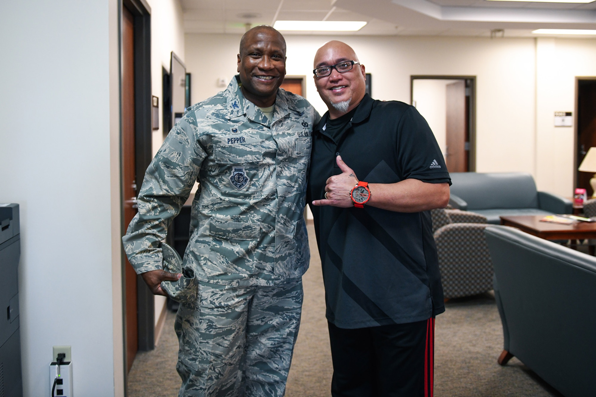 Col. Devin Pepper, 460th Space Wing commander, and Alan Muriera, 460th Medical Group health promotion manager, pose for a photo, March 5, 2020, at the Human Performance Center at Buckley Air Force Base, Colo.