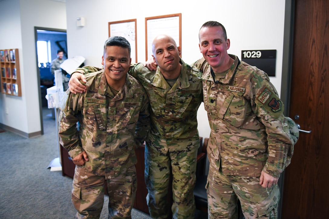 From left to right, Master Sgt. Socrates Plantilla, 460th Medical Group dental clinic flight chief, Chief Master Sgt. Robert Devall, 460th Space Wing command chief, and Lt. Col. Christian Smith, 460th Medical Group medical operations commander, pose for a photo, March 5, 2020, at the Human Performance Center at Buckley Air Force Base, Colo.
