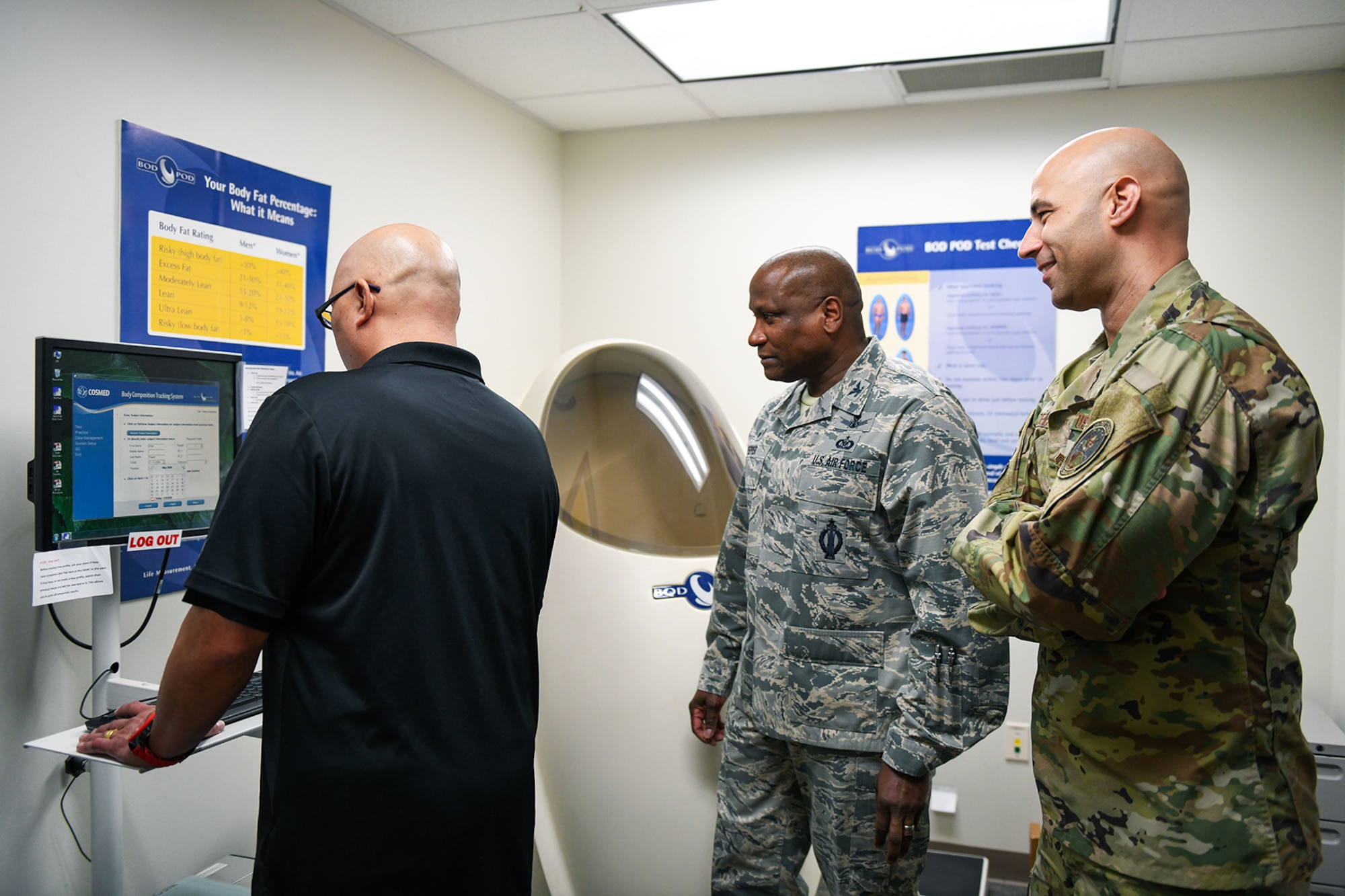 Alan Muriera, 460th Medical Group health promotion manager, begins inputting information into a computer with Col. Devin Pepper, 460th Space Wing commander, Chief Master Sgt. Robert Devall, 460th Space Wing command chief, March 5, 2020, at the Human Performance Center at Buckley Air Force Base, Colo.
