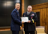 Brig. Gen. Michael Glisson of Festus, Missouri, stands with Brig. Gen. Richard Neely of Springfield, Illinois, the Adjutant General of the Illinois National Guard, after being presented the Legion of Merit at his retirement ceremony March 7, at the Illinois Military Academy in Springfield, Illinois.