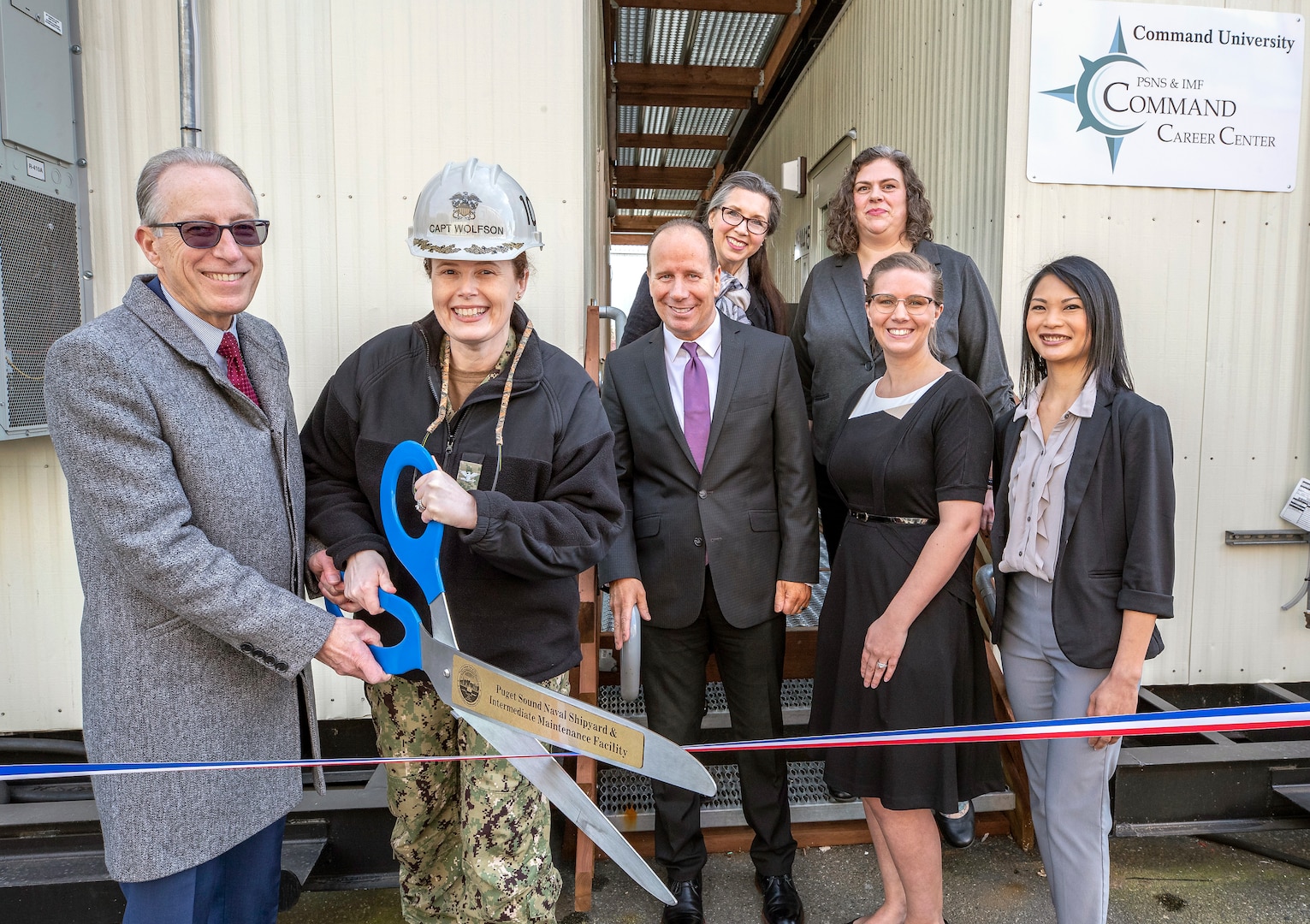 Capt. Dianna Wolfson, commander, Puget Sound Naval Shipyard & Intermediate Maintenance Facility, cuts the ribbon during the official opening celebration for the Command Career Center Feb. 26. Pictured with Wolfson are Richard Tift, executive director, PSNS & IMF, and the Career Counseling Team, Heidi Anderson and CeCe Norgaard (top row), and David Tift, Britany Ashley and Eleanor McCann.