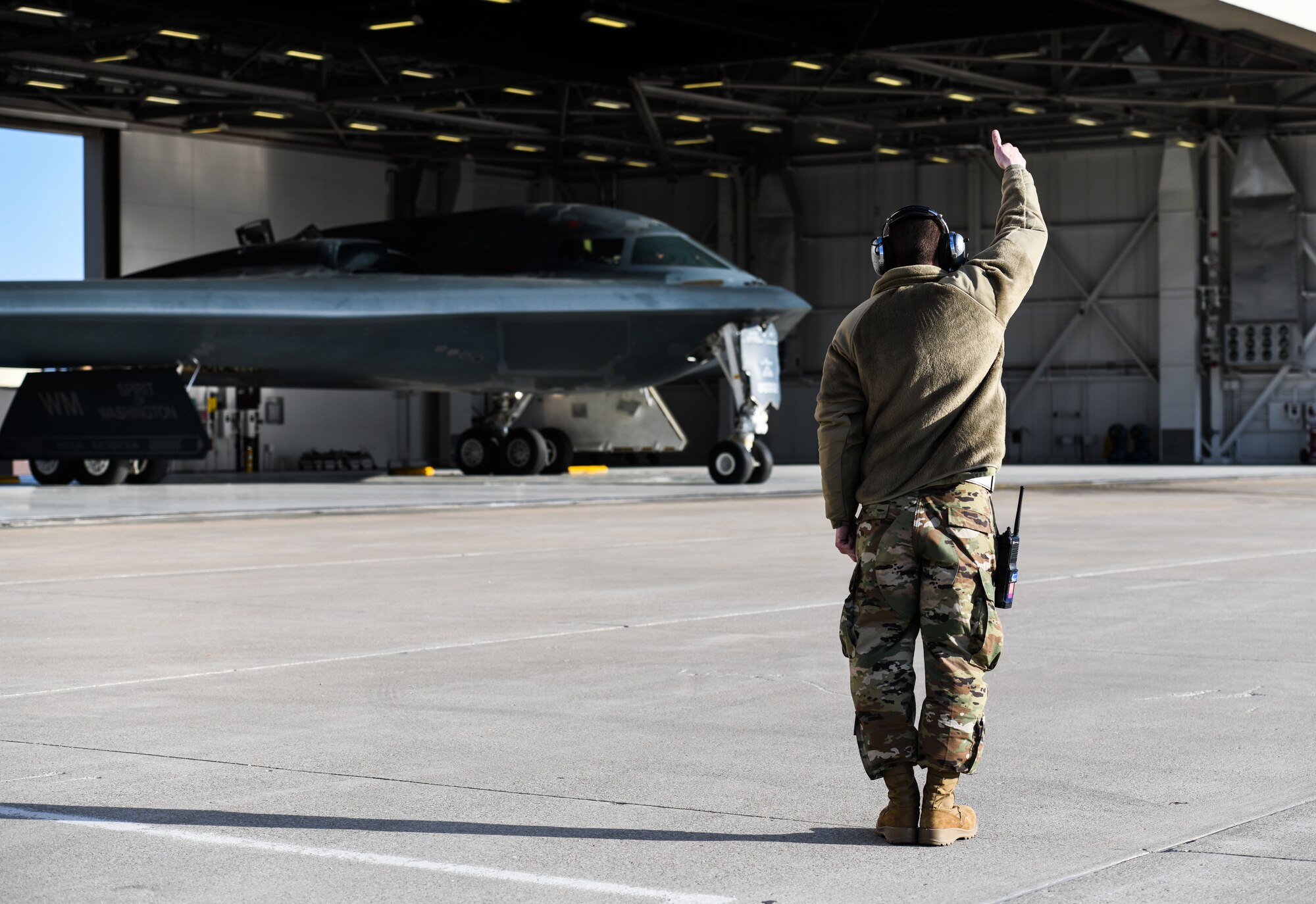 U.S. Air National Guard Tech. Sgt. Justin Aeckerle, a B-2 crew chief assigned to the 131st Maintenance Squadron, gives a thumbs-up hand signal to a B-2 Spirit pilot before takeoff at Whiteman Air Force Base, Missouri, March 8, 2020. The B-2 took off from Whiteman AFB to support U.S. Strategic Command Bomber Task Force operations in Europe. The 131s Bomb Wing’s 131st MXS is the total-force partner unit to the 509th Bomb Wing. (U.S. Air Force photo by Tech. Sgt. Alexander W. Riedel)