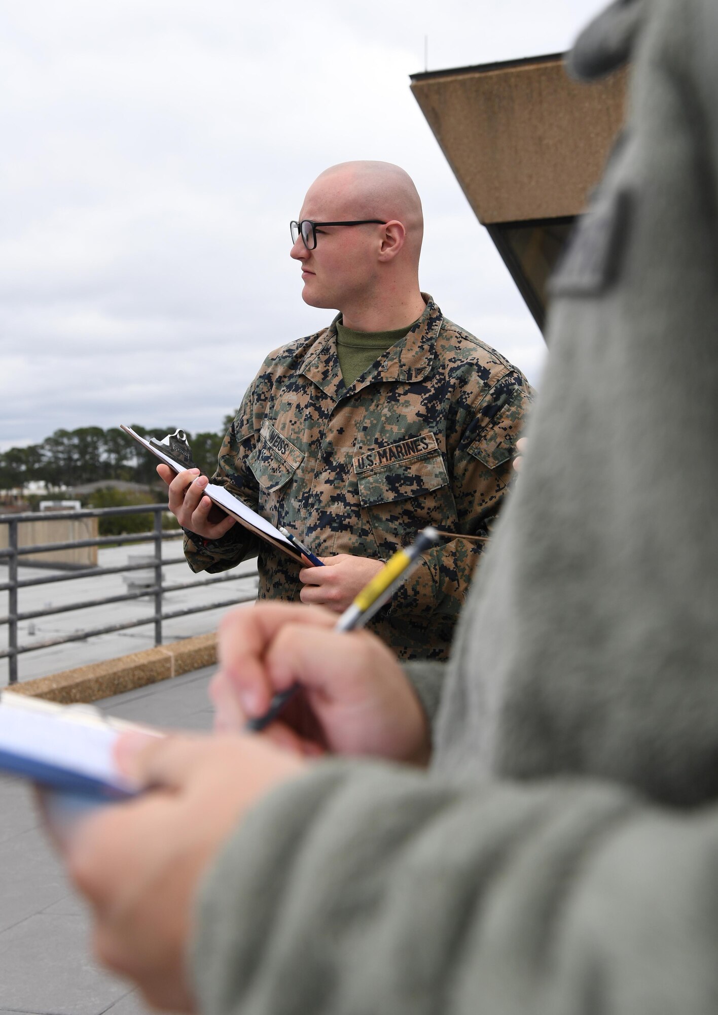 U.S. Marine Corps Lance Cpl. Hayden Weiss, Keesler Marine Detachment student, records a weather observation on top of the Joint Weather Training Facility at Keesler Air Force Base, Mississippi, Jan. 27, 2020. The weather apprentice course, which graduated 650 students this past year, takes 151 academic days to complete. Approximately 7,400 students go through the 335th TRS's 13 Air Force Specialty Codes each year. (U.S. Air Force photo by Kemberly Groue)