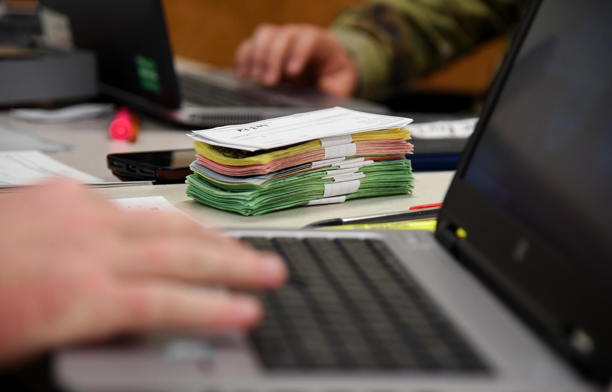 Stacks of play money is displayed on a desk inside Allee Hall at Keesler Air Force Base, Mississippi, Feb. 3, 2020. The finance management course, which graduated 220 students this past year, takes nine academic days to complete. Approximately 7,400 students go through the 335th TRSs 13 Air Force Specialty Codes each year. (U.S. Air Force photo by Kemberly Groue)