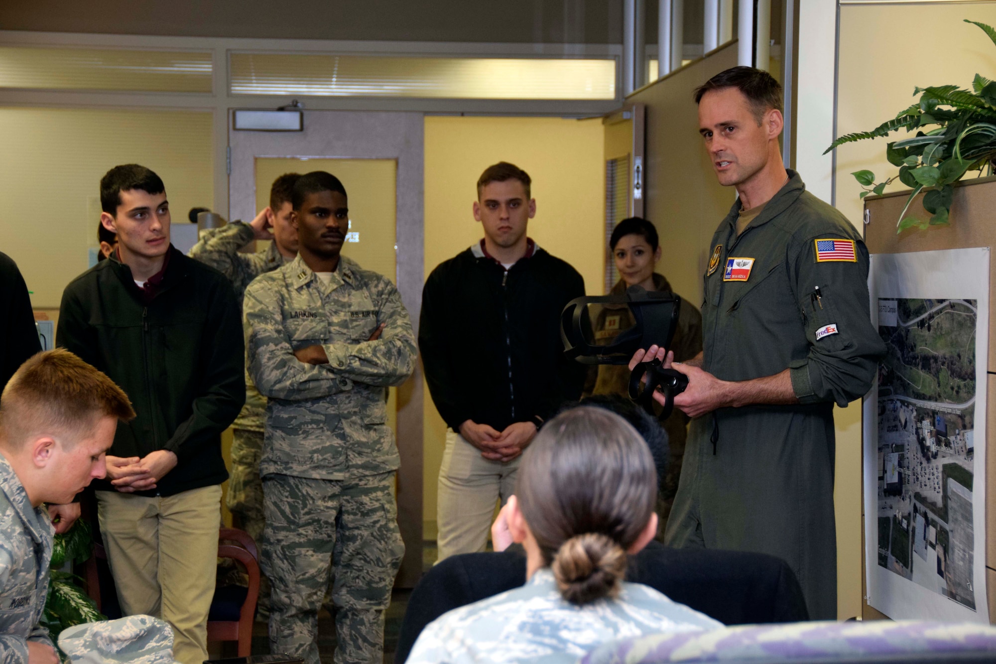 Senior Master Sgt. Brian Mizula, 733rd Training Squadron instructor flight engineer, explains C-5M Super Galaxy aircraft training to members of the Air Force Reserve Officer Training Corps Detachment 840 with Texas State University at Joint Base San Antonio-Lackland, March 3, 2020.
