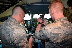 Members of the Air Force Reserve Officer Training Corps Detachment 840 with Texas State University pose in the cockpit of the C-5M Super Galaxy aircraft at Joint Base San Antonio-Lackland, March 3, 2020.