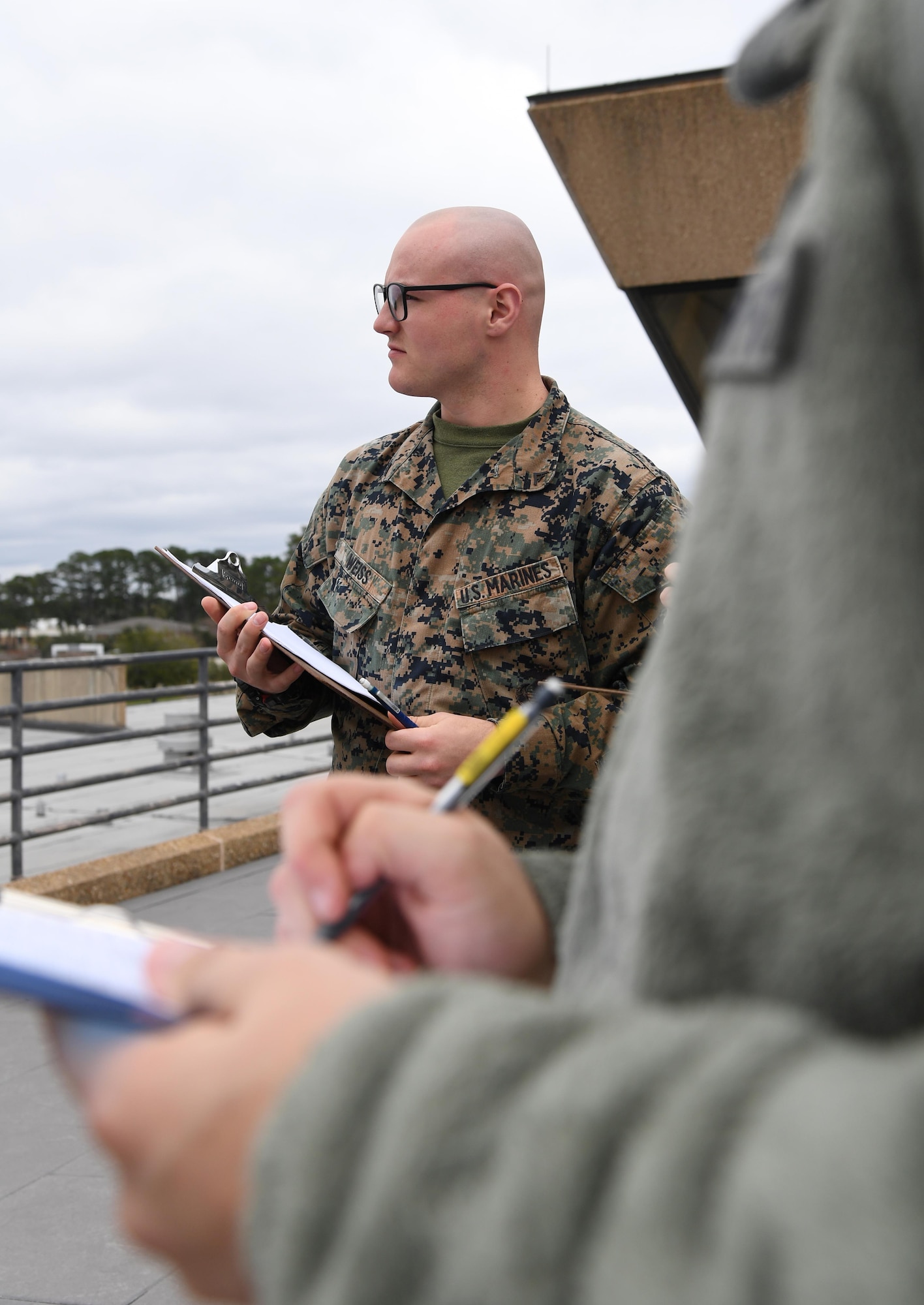 U.S. Marine Corps Lance Cpl. Hayden Weiss, Keesler Marine Detachment student, records a weather observation on top of the Joint Weather Training Facility at Keesler Air Force Base, Mississippi, Jan. 27, 2020. The weather apprentice course, which graduated 650 students this past year, takes 151 academic days to complete. Approximately 7,400 students go through the 335th TRS's 13 Air Force Specialty Codes each year. (U.S. Air Force photo by Kemberly Groue)
