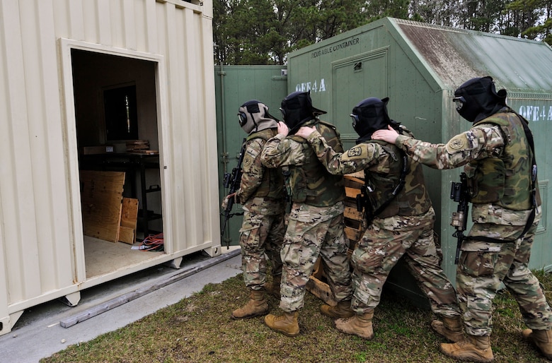 Cadets from the Citadel prepare to enter a shoot house for a live-fire exercise at the Naval Weapons Station Charleston, Joint Base Charleston, S.C., March 3, 2020.