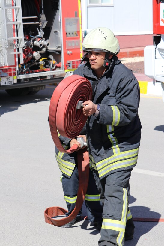 Civil Defence Department (CDD) firefighters respond to a simulated building fire at Joint Training Center-Jordan (JTC-J) Wednesday. The CDD and JTC-J partnered on the event with coordination from the Jordan Armed Forces. U.S. Soldiers are in Jordan to conduct partnership training with the JAF and other Jordanian partners. The U.S. has a long-standing partnership with Jordan in regards to joint training that has endured over multiple administrations.