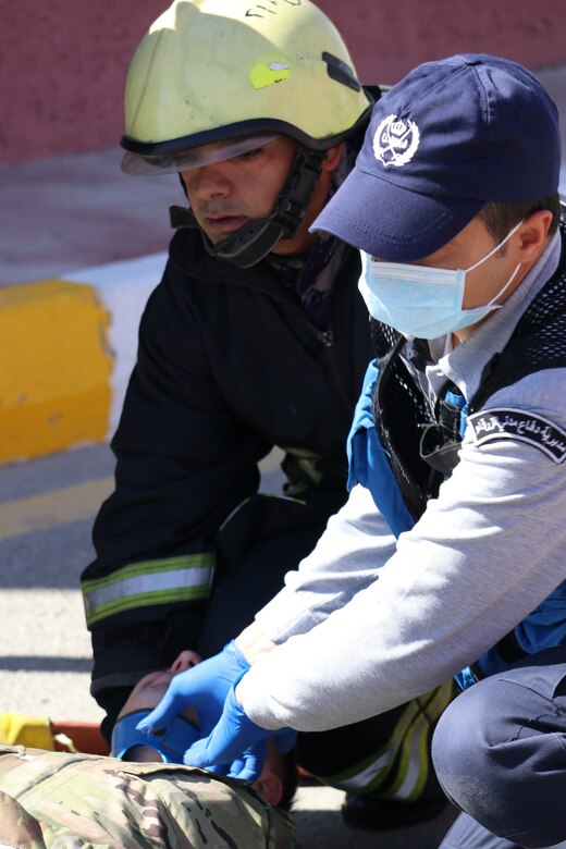 Civil Defence Department (CDD) paramedics treat simulated injuries at Joint Training Center-Jordan (JTC-J) Wednesday. The CDD and JTC-J partnered on the event with coordination from the Jordan Armed Forces. U.S. Soldiers are in Jordan to conduct partnership training with the JAF and other Jordanian partners. The U.S. has a long-standing partnership with Jordan in regards to joint training that has endured over multiple administrations.