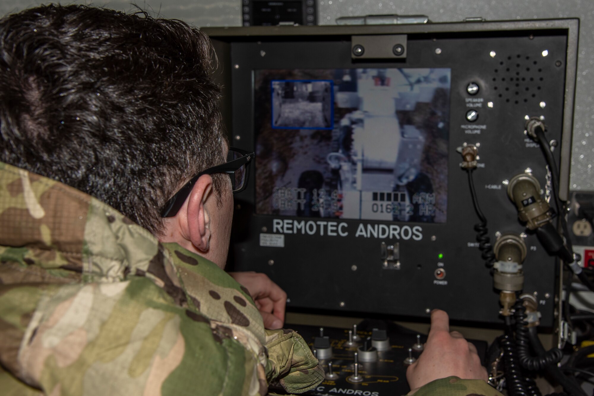 U.S. Air Force Airman 1st Class Graham Newman, a 35th Aircraft Maintenance Squadron aircraft structural maintenance journeyman, operates a bomb disposal robot at Misawa Air Base, Japan, March 3, 2020. The robot is equipped with several television cameras for remote viewing and a dexterous arm for hazardous tasks. (U.S. Air Force photo by Airman 1st Class China M. Shock)