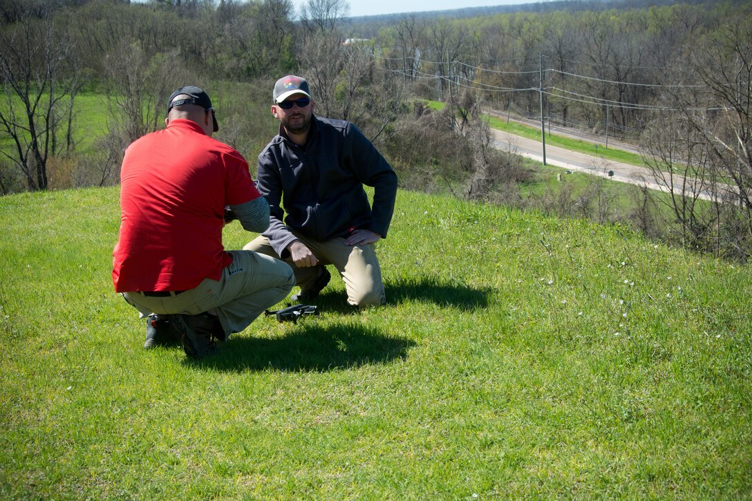 Daniel Hickman and David Nguyen, members of the U.S. Army Engineer Research and Development Center’s Coastal and Hydraulics Laboratory’s Unmanned Aircraft Systems Team, prepare a UAS for flight over a landslide at the Vicksburg National Military Park.