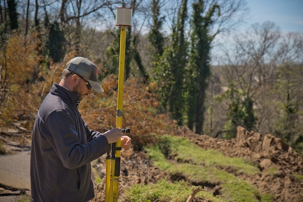 Daniel Hickman, a civil engineering technician and member of the U.S. Army Engineer Research and Development Center’s Coastal and Hydraulics Laboratory’s Unmanned Aircraft Systems Team, sets up equipment for a UAS flight over a landslide at the Vicksburg National Military Park