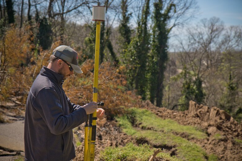 Daniel Hickman, a civil engineering technician and member of the U.S. Army Engineer Research and Development Center’s Coastal and Hydraulics Laboratory’s Unmanned Aircraft Systems Team, sets up equipment for a UAS flight over a landslide at the Vicksburg National Military Park