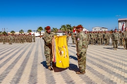 Lt. Col. David E. Moulton, commander of the 1st Squadron,112th Cavalry Regiment, Texas National Guard, and Command Sgt. Maj. Bradley A. Sutton, the 1-112th senior enlisted advisor, roll and uncase their colors to signify the start of their mission at a transfer of authority ceremony on South Camp, in Sharm el-Sheikh, Egypt, March 8, 2020. The 1-112th assumes responsibility as the 67th rotational United States Army unit in support of the Multinational Force and Observers peacekeeping mission.