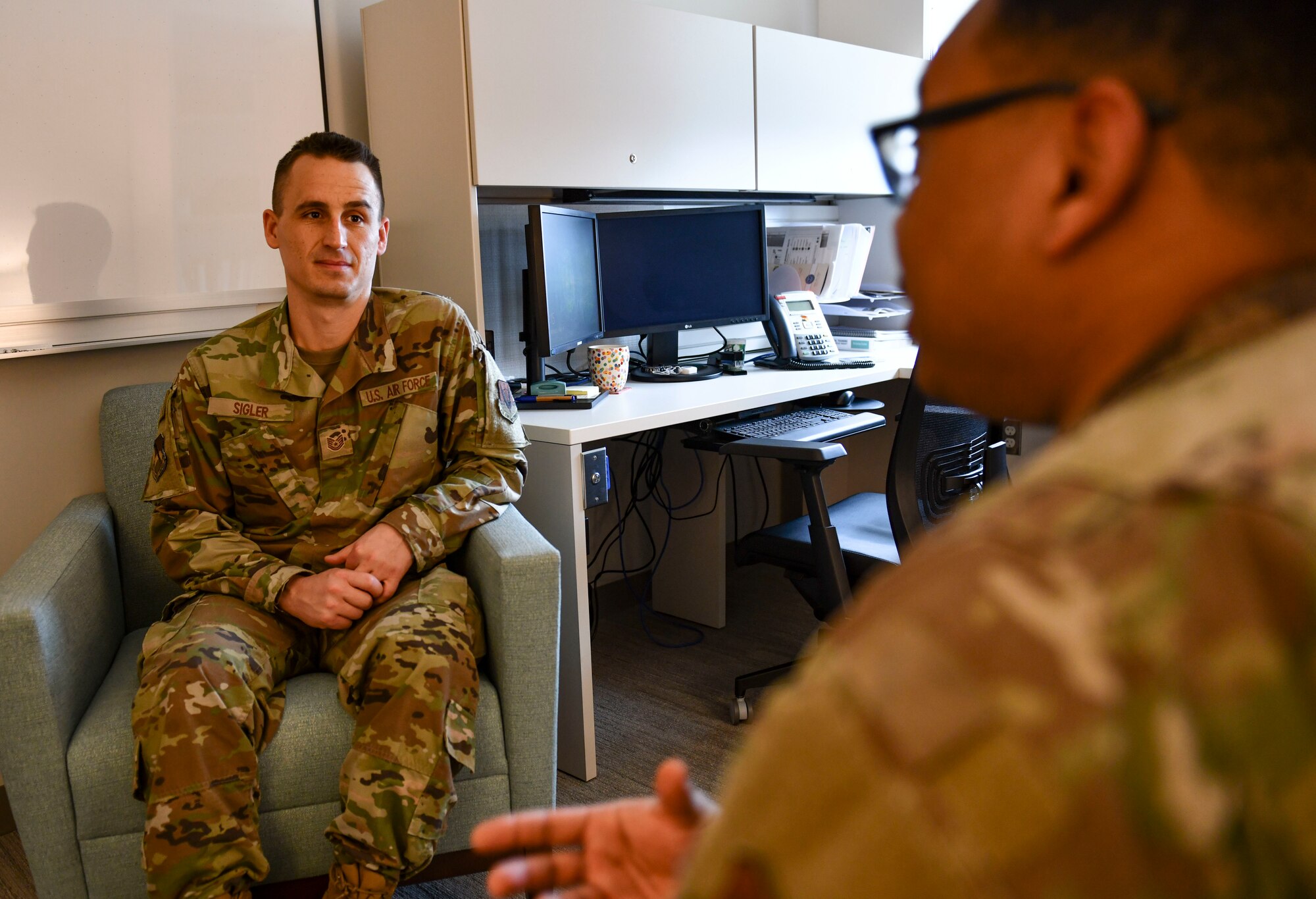 U.S. Air Force Tech. Sgt. James Sigler, 325th Operational Medical Readiness Squadron mental health flight chief, talks with a patient at Tyndall Air Force Base, Florida, March 4, 2020. Sigler is in charge of the mental health clinic's daily operations and makes sure the patients get the care they need. (U.S. Air Force photo by Senior Airman Stefan Alvarez)
