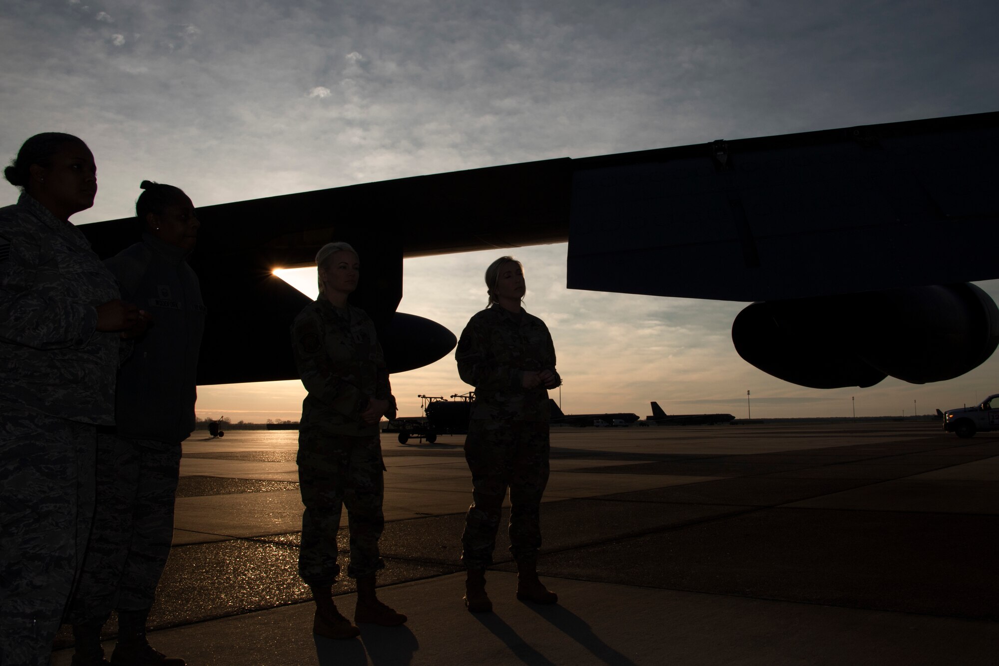 Photo of Airmen standing outside a B-52.