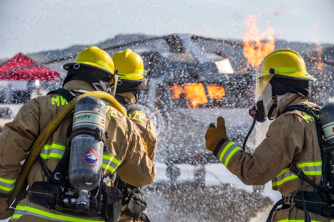 A U.S. Marine gives Marines instructions during mobile aircraft fire training on MCAS Camp Pendleton, Calif., March 5.