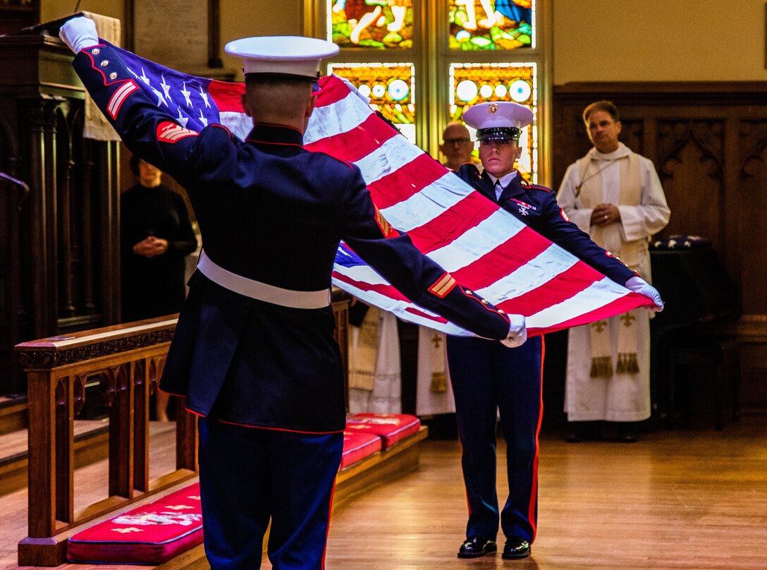Marines with Marine Forces Reserves present the American flag at the memorial service of Brooke Helm Duncan at The Trinity Episcopal Church, New Orleans, Feb. 1, 2020. Mr. Duncan was a retired Corsair pilot for the United States Marine Corps and an Active civic leader in his community. (U.S. Marine Corps photo by Lance Cpl. Samwel Tabancay)