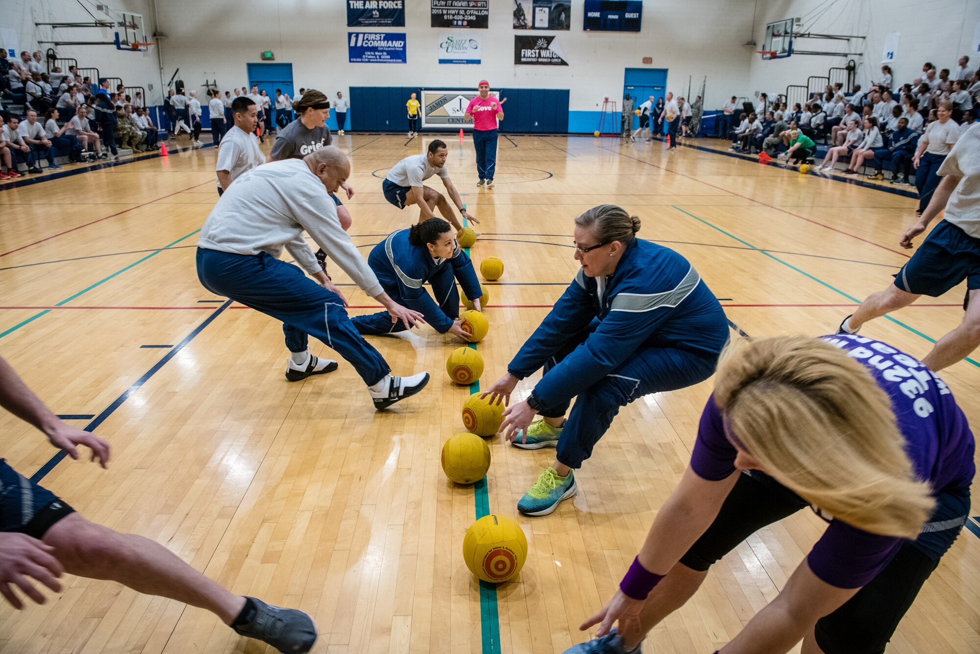 Citizen Airmen with the 932nd Medical Group join in some team building dodgeball during a resiliency pause February 9, 2020 Scott Air Force Base, Illinois. The intent of the planned pause is to give leadership and Airmen a chance to bond and create some camaraderie. (U.S. Air Force photo by Master Sgt. Christopher Parr)