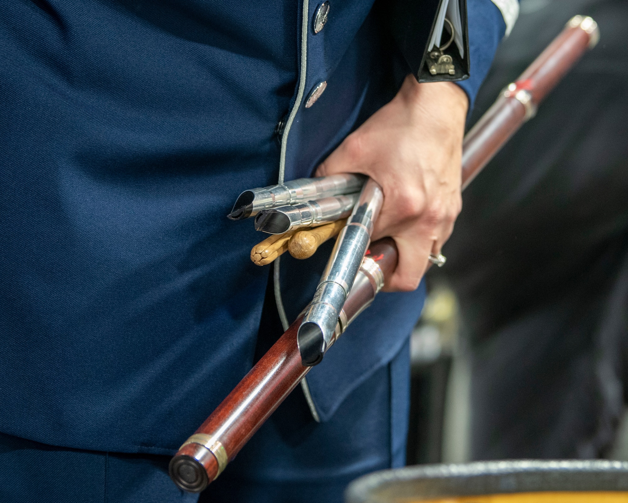 Master Sgt. Julia Cuevas, U.S. Air Force Band ensemble Celtic Aire traditional Irish instrumentalist and vocalist, holds a handful of her instruments before a performance during the 38th Annual North Texas Irish Festival in Dallas, Tx., March 7, 2020. The North Texas Irish Festival was March 6-8, and provided an opportunity for Celtic Aire to perform music that reflects the culture of the Irish and put a classic spin on modern pop songs. (U.S. Air Force photo by Staff Sgt. Jared Duhon)