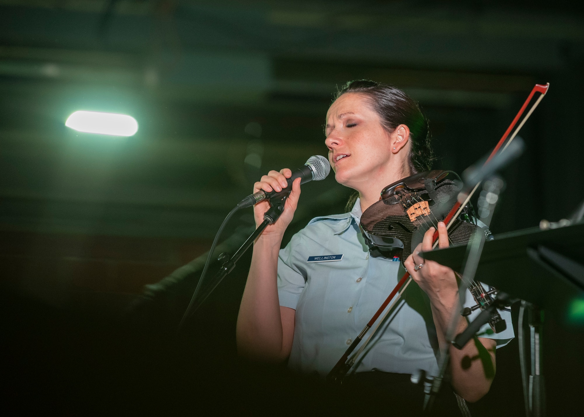 Master Sgt. Emily Wellington, U.S. Air Force Band ensemble Celtic Aire violinistand vocalist, sings during the 38th Annual North Texas Irish Festival in Dallas, Tx., March 7, 2020. Before the NTIF, Celtic Aire was on hiatus due to their roles in the Singing Sergeants, which is the official chorus of the United States Air Force. (U.S. Air Force photo by Staff Sgt. Jared Duhon)