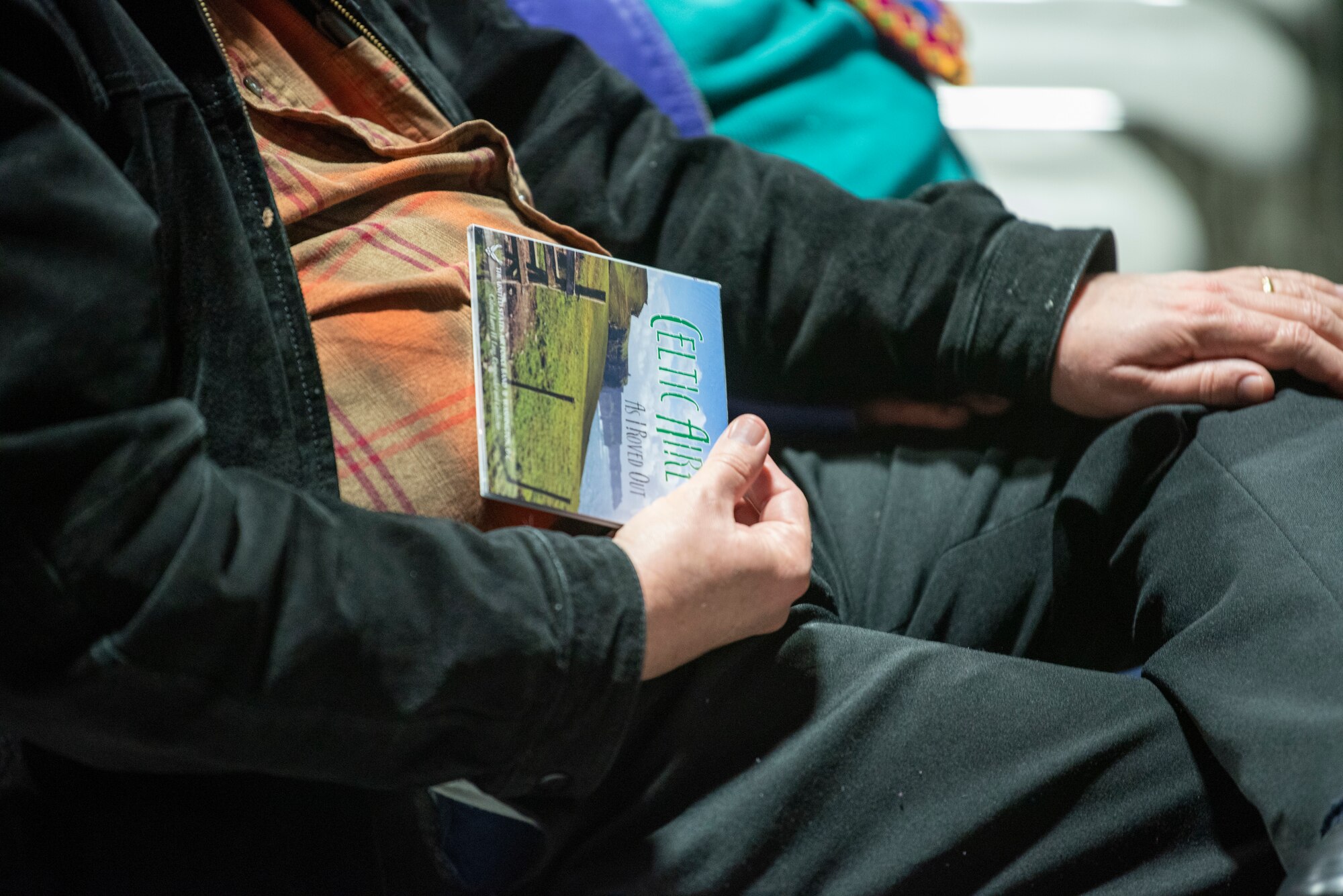 A North Texas Irish Festival attendee holds a cd from U.S. Air Force Band ensemble Celtic Aire at the North Texas Irish Festival in Dallas,Tx., March 8, 2020. Celtic Aire is the premier Celtic and folk ensemble of the United States Air Force. Formed in 2007, the group is comprised of six Airmen musicians from The United States Air Force Band’s Singing Sergeants, the official chorus of the U.S. Air Force. (U.S. Air Force photo by Staff Sgt. Jared Duhon)