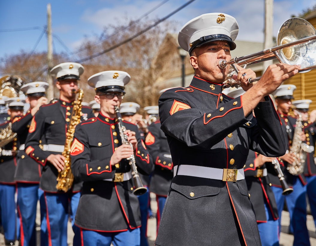 U.S. Marine Corps band members with the Marine Forces Reserve Band march toward the stage during the Algiers Festival 2020 in Federal City, New Orleans, Feb. 1, 2020. The band performed to show their support towards the New Orleans community and kicked off the Algiers Festival 2020. (U.S. Marine Corps photo by Lance Cpl. Leslie Alcaraz)
