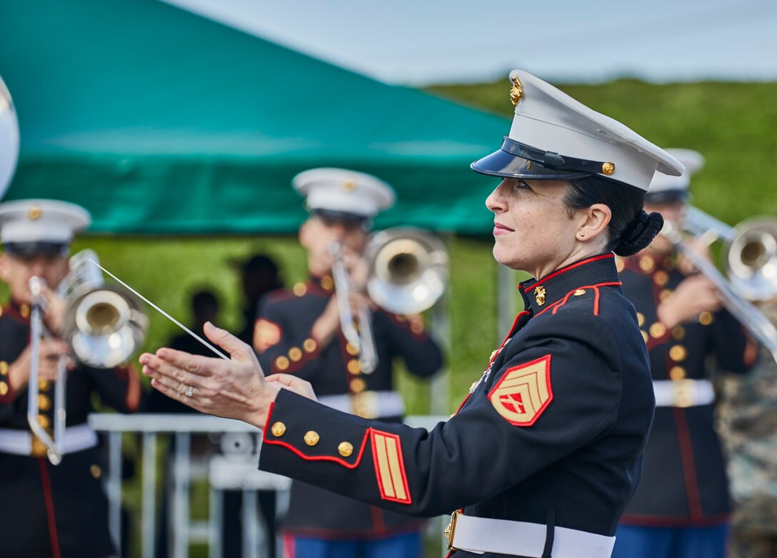 Staff Sgt. Megan Harper, enlisted conductor with the Marine Forces Reserve Band, directs the band during the Algiers Festival 2020 in Federal City, New Orleans, Feb. 1, 2020. The band performed to show their support towards the New Orleans community and kicked off the Algiers Festival 2020. (U.S. Marine Corps photo by Lance Cpl. Leslie Alcaraz)