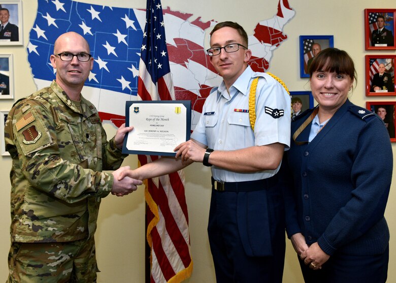 U.S. Air Force Lt. Col. Kevin Boss, 17th Training Group director of operations, presents the 17th Training Group Rope of the Month award to Airman 1st Class Jeremy Nelson, 316th TRS student, at Brandenburg Hall on Goodfellow Air Force Base, Texas, February 6, 2020. Military Training Leaders present different ropes to Airmen who display exceptional qualities to lead their peers in various aspects of the training pipeline. (U.S. Air Force photo by Airman 1st Class Robyn Hunsinger)