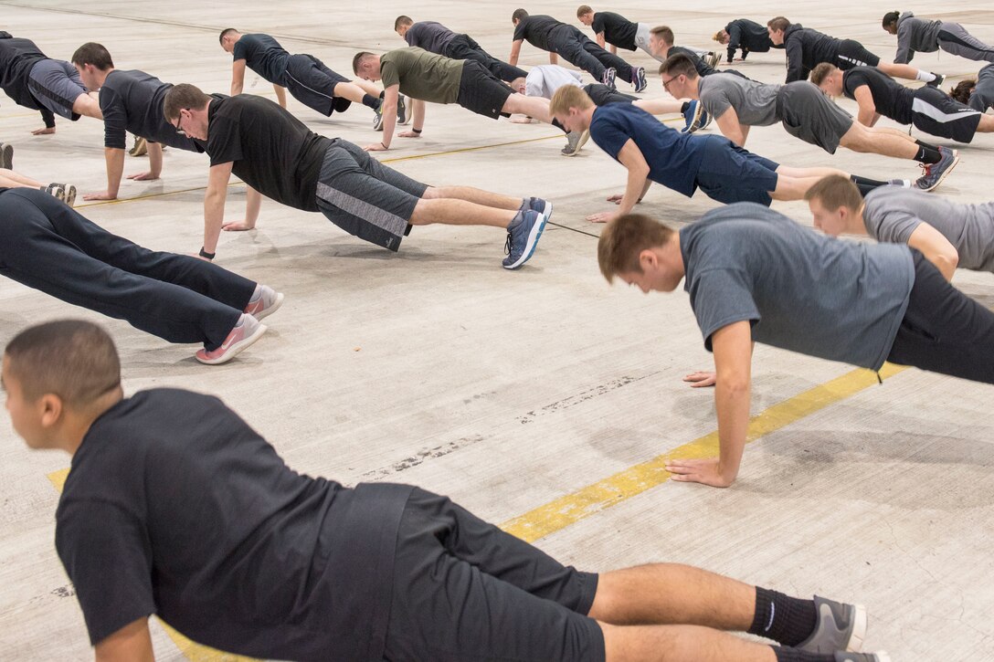 Newly enlisted Airmen assigned to the 167th Student Flight participate in a group physical fitness session, Feb. 1, 2020. The student flight program prepares the wing's newest Airmen for U.S. Air Force basic training.