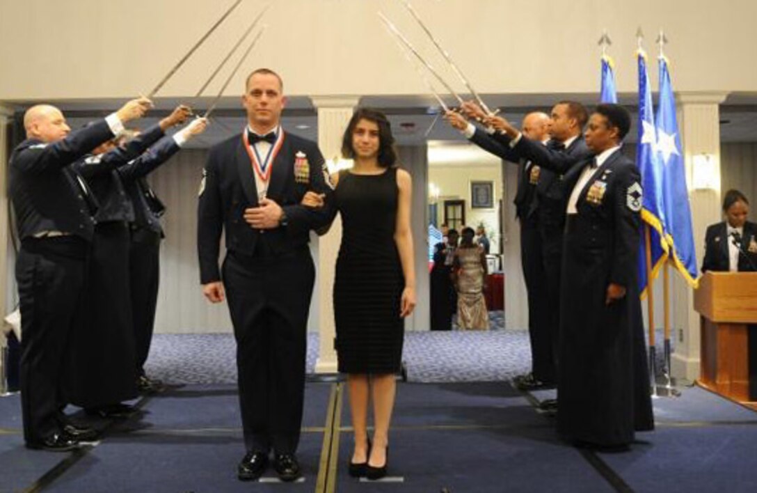 Then-Senior Master Sgt. Thomas Daniels poses for a photo with his daughter, Dakotah Daniels 15, during a Chief Induction Ceremony at Joint Base Anacostia-Bolling, Washington D.C., in January 2013. (Courtesy photo)