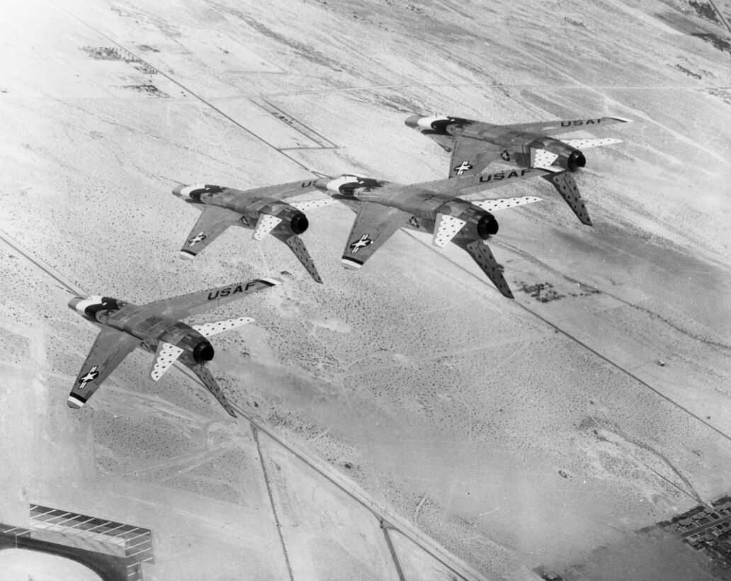 An aerial view of four Thunderbird jets performing over Hill Air Force Base.