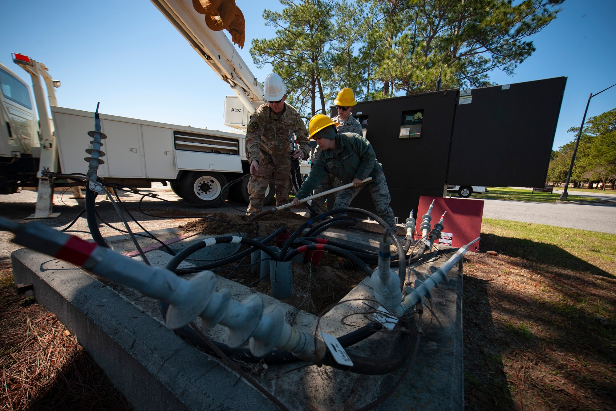 A photo of Airmen digging up dirt