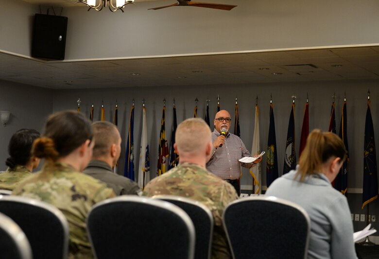 Michael Birriel, 14th Force Support Squadron Community Services flight chief, addresses the audience during the Quality of Life Town Hall March 5, 2020, at the Columbus Club on Columbus Air Force Base, Miss. Birriel spoke on various upcoming events and accomplishments going on in community services to include the Arts & Crafts Center, Bowling Center, and Information, Tickets and Travel. (U.S. Air Force photo by Airman Hannah 1st Class Bean)