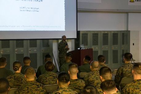 U.S. Sailor Lt. Cmdr. Tyrone Robinson, Senior Medical Officer for Chemcial Biological Incident Response Force (CBIRF), addresses the battalion aboard Naval Support Facility Indian Head, Md., on March 10, 2020. The battalion was given a brief on the most up to date information about Corona Virus. (Official U.S. Marine Corps. photo by Lance Cpl. Blakely Graham)