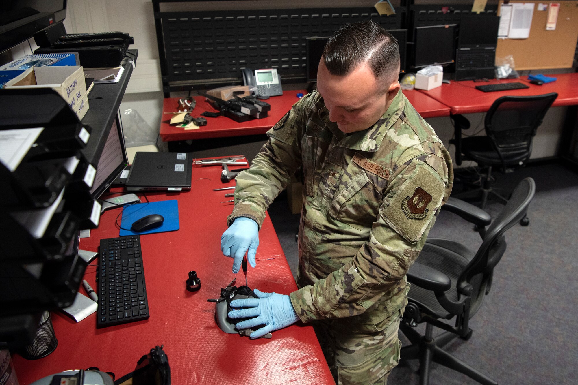 U.S. Air Force Senior Airman Sabastion Duke, 52nd Operations Support Squadron Aircrew Flight Equipment journeyman, inspects an aircrew mask at Spangdahlem Air Base, Germany, March 4, 2020. Aircrew gear is regularly inspected for discrepancies to ensure pilots are safe during flight or an emergency scenario. (U.S. Air Force photo by Senior Airman Valerie R. Seelye)