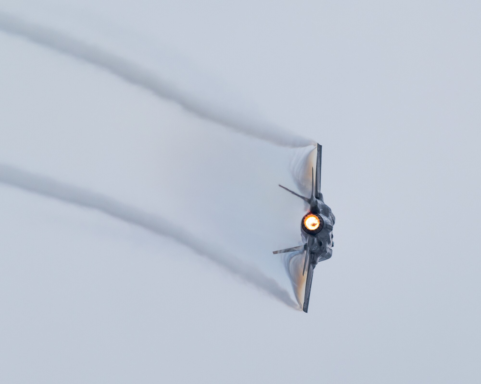 An F-35A Lightning II banking during a demonstration practice.