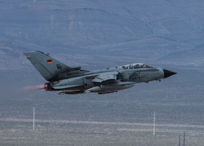 Aircraft flies in the air.