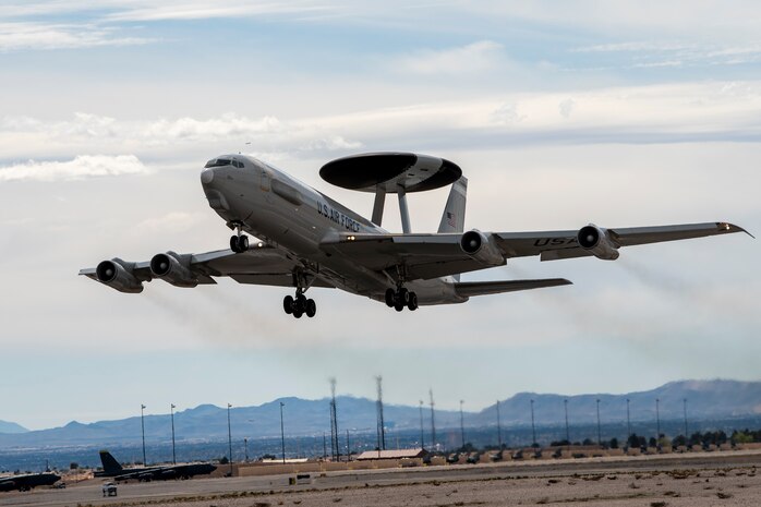 Aircraft flies in the air.
