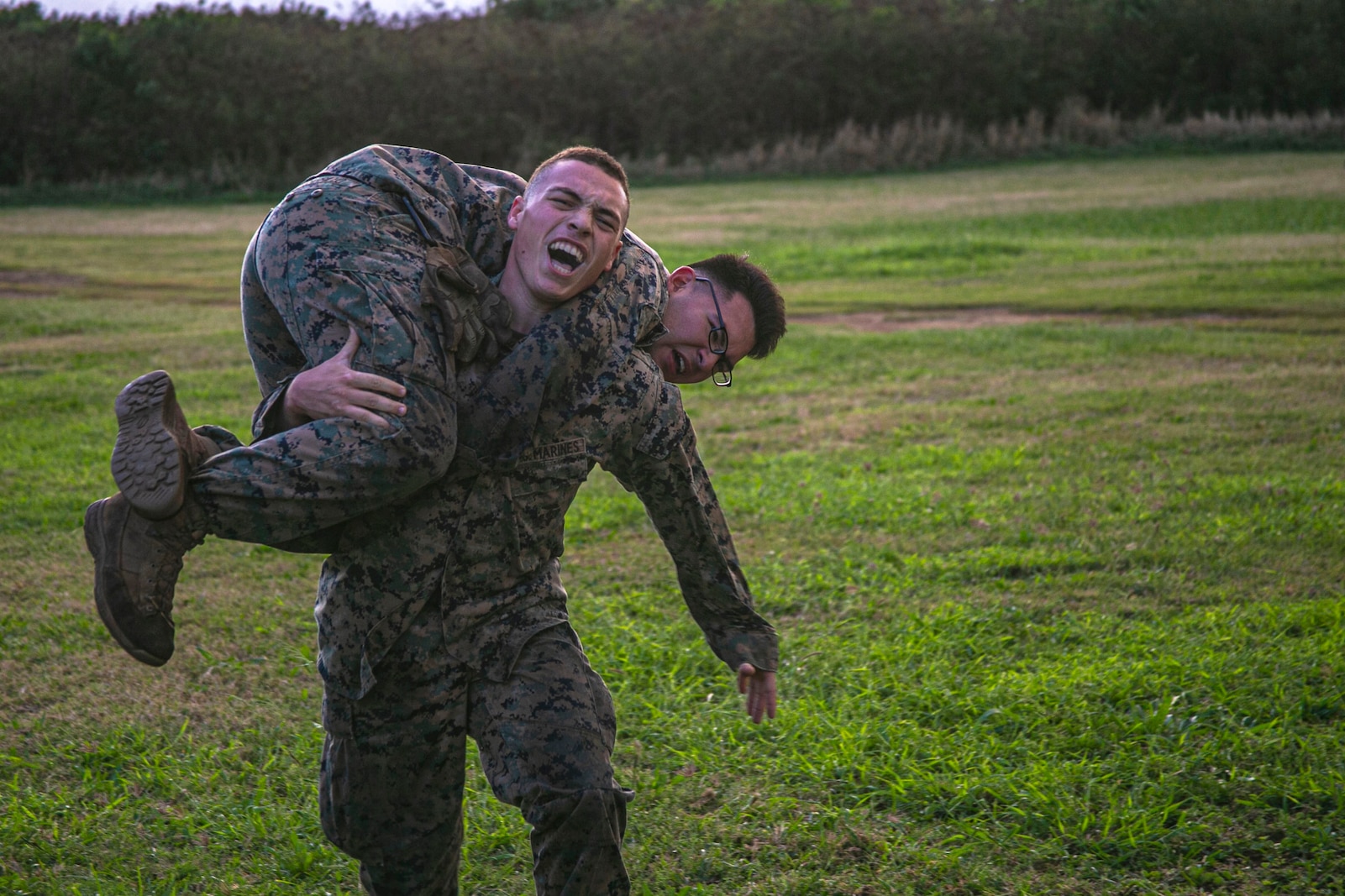 U.S. Marines with India Company, 3rd Battalion, 3rd Marine Regiment, conduct fireman carries during a company-level physical training event honoring Lance Cpl. William R. Prom on Marine Corps Base Hawaii, Feb. 10, 2020. Lance Cpl. Prom was with the unit when his actions in Vietnam during Operation Taylor Common were awarded with the Medal of Honor. (U.S. Marine Corps photo by Lance Cpl. Jacob Wilson)
