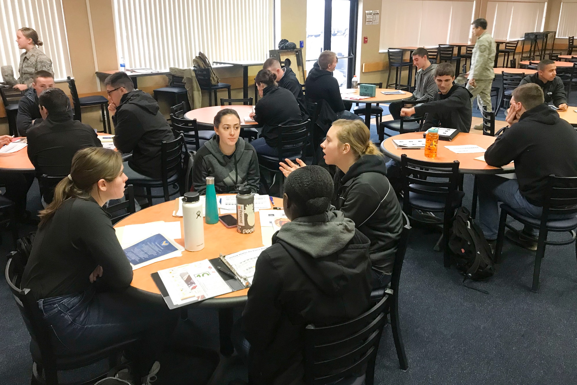 Newly enlisted Airmen assigned to the 167th Student Flight meet in the wing's dining facility, Feb. 1, 2020. The student flight program prepares the wing's newest Airmen for U.S. Air Force basic training.