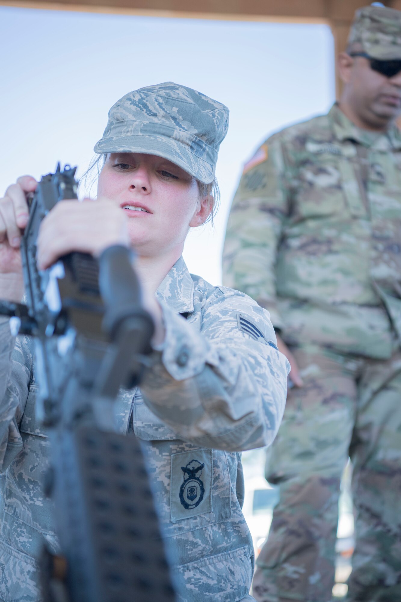 Senior Airman Sarah Lewis, a member of the 149th Security Forces Squadron, reassembles an M249 light machine gun during the Texas Military Department’s 2020 Best Warrior Competition March 7, 2020, at Camp Swift, Texas.