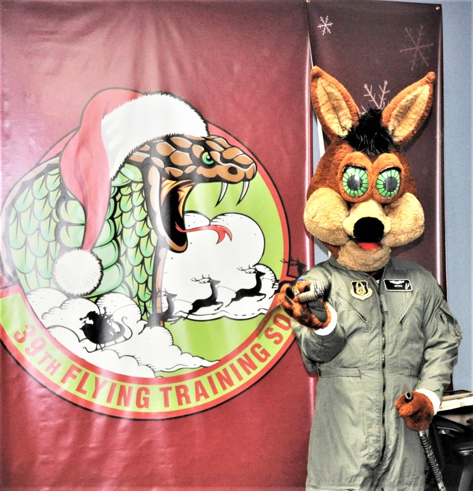 The Spurs Coyote checks out the 39th Flying Training Squadron ‘dojo’ at Joint Base San Antonio-Randolph, Texas February 25 where Regular Air Force, Air Force Reserve, and civilian Airmen from the 340th Flying Training Group headquarters, 39th Flying Training Squadron T-6 Texan Flight, 12th Flying Training Wing Safety, 559th Flying Training Squadron T-6 team, and 3rd Combat Camera Squadron (JBSA-Lackland) members, and the NBA San Antonio Spurs production crew worked to put the Coyote through the pilot training process. Video footage will be used for a Spurs Military Appreciation video to be shown during the March 10 game. (U.S. Air Force photo by Janis El Shabazz)