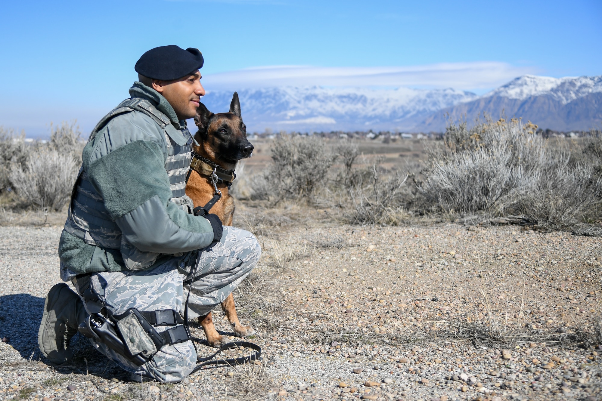 Staff Sgt. Paul Bryant, 75th Security Force Squadron, sits with Xxuthus, a military working dog, at Hill Air Force Base, Utah, March 4, 2020. Bryant has been XXuthus's handler for six months. Xxuthus is a single-purpose MWD, trained as an explosive detection dog. (U.S. Air Force photo by Cynthia Griggs)